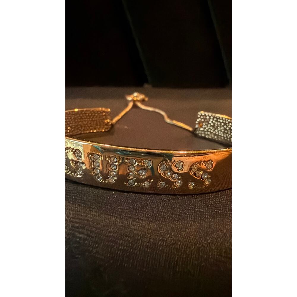 GUESS gold-toned cuff bangle  logo spelled out in pave-set crystals 7.25” glam